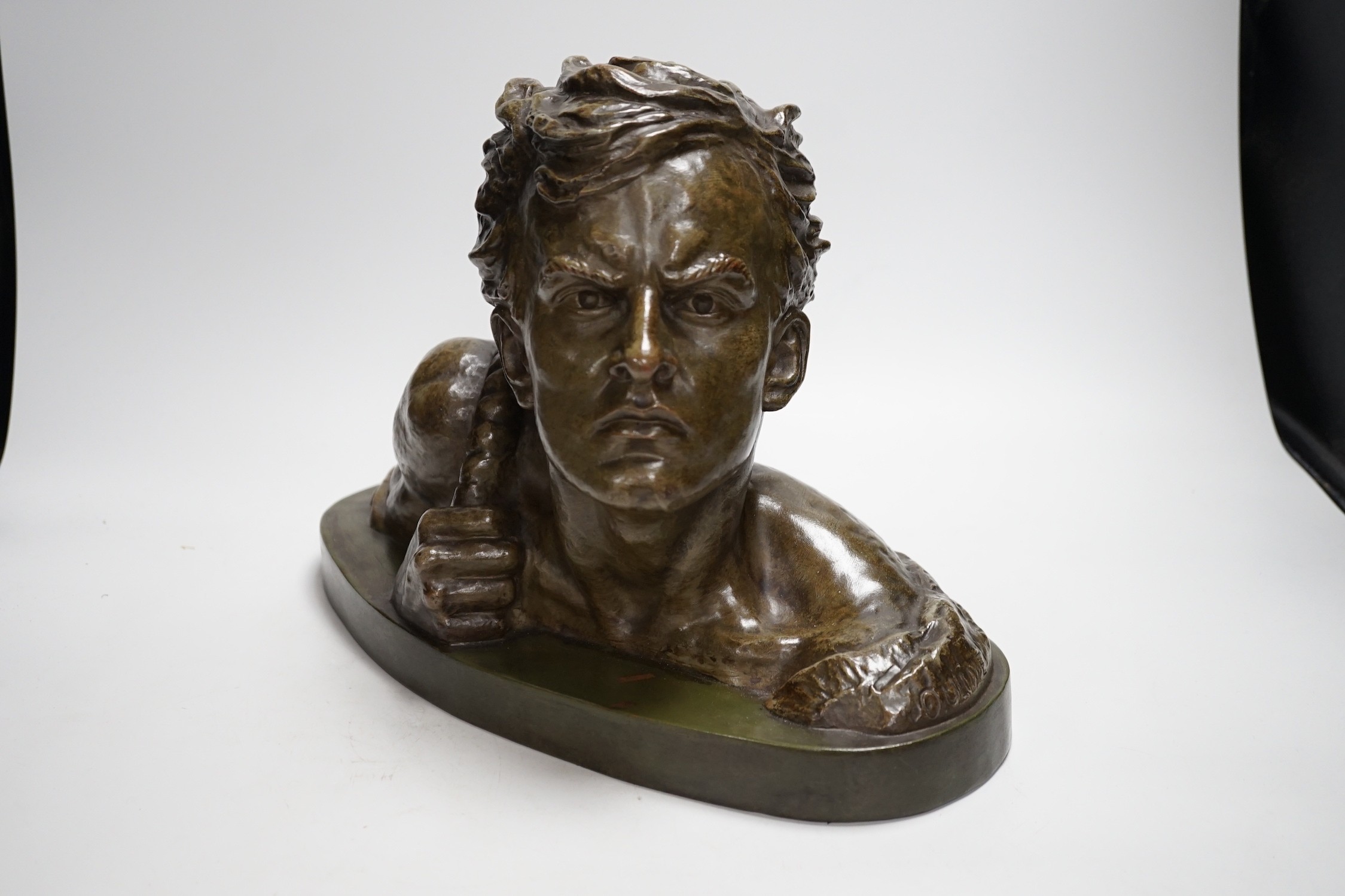 A French Art Deco terracotta bronzed glazed bust, signed Ouline. 27cm tall